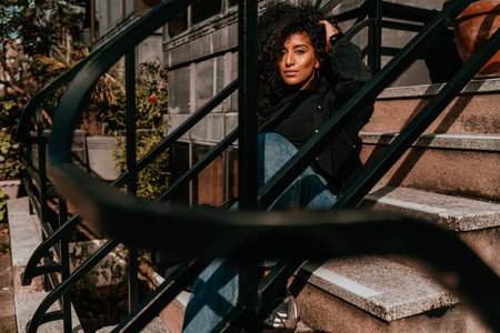 Portrait Charming Young African Woman with Curly Hair, Street Style, Posing Outdoors