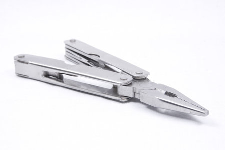 A multi-tool with pliers selected isolated on a white background.の写真素材