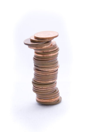 A tower of pennys, isolated on a white background.  A metaphor for teh unstable economy? Fiscal...