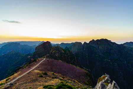 Sunset shot from the top of Pico do Arieiro Madeira island in Portugal showing a hiking track on the top of the mountains at summerの写真素材