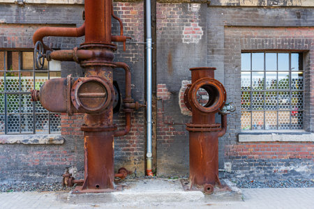 Abandoned industrial building interior. old damaged boiler room. Old rusty industrial pipes. Old...