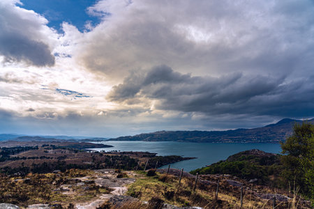 dramatic clouds lake mountains highlands scotland landscape hiking