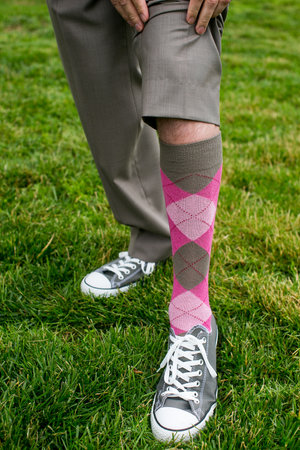 funky sock pulled up with grey sneakersの写真素材