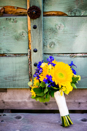 Bridal bouquet with sunflowers, delphinium, aspen leavesの写真素材