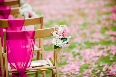 White Dendrobium Orchid and Pink Ginger flower on a wedding aisle for a destination weddingの写真素材