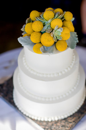 Pretty white wedding cake at a wedding receptionの写真素材