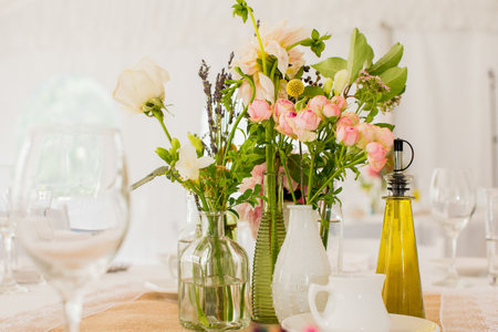Fresh flower centerpiece on a tableの写真素材