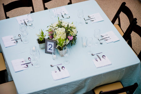 Overhead view of a floral centerpiece on a square table at a formal eventの写真素材