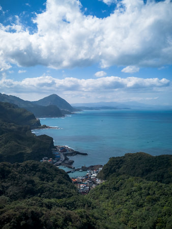 Aerial view of Bitoujiao lighthouse, a famous scenery of Taiwan northeast corner. Birds eye view in Bitoujiao cape, Ruifang district, New Taipei, Taiwan.の写真素材