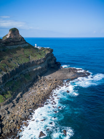 Aerial view of Bitoujiao lighthouse, a famous scenery of Taiwan northeast corner. Birds eye view in Bitoujiao cape, Ruifang district, New Taipei, Taiwan.の写真素材