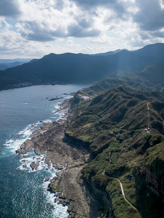 Aerial view of Bitoujiao lighthouse, a famous scenery of Taiwan northeast corner. Birds eye view in Bitoujiao cape, Ruifang district, New Taipei, Taiwan.の写真素材