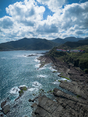 Aerial view of Bitoujiao lighthouse, a famous scenery of Taiwan northeast corner. Birds eye view in Bitoujiao cape, Ruifang district, New Taipei, Taiwan.の写真素材