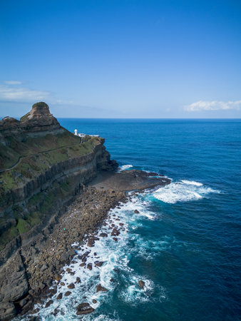 Aerial view of Bitoujiao lighthouse, a famous scenery of Taiwan northeast corner. Birds eye view in Bitoujiao cape, Ruifang district, New Taipei, Taiwan.の写真素材