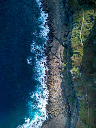 Aerial view of Bitoujiao lighthouse, a famous scenery of Taiwan northeast corner. Birds eye view in Bitoujiao cape, Ruifang district, New Taipei, Taiwan.の写真素材