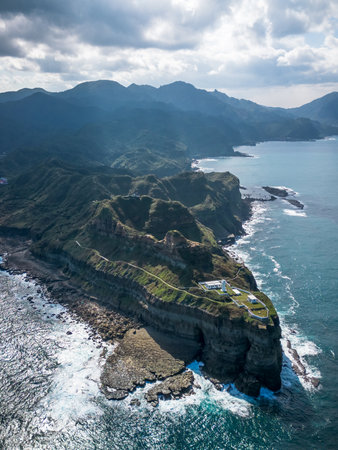 Aerial view of Bitoujiao lighthouse, a famous scenery of Taiwan northeast corner. Birds eye view in Bitoujiao cape, Ruifang district, New Taipei, Taiwan.の写真素材