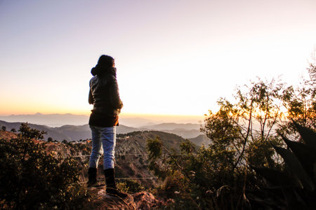Person watching sunrise from a mountain