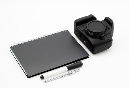 Stylish Minimalist Workspace Concept With Camera, Planner, Pen, Marker On White Backgroundの写真素材
