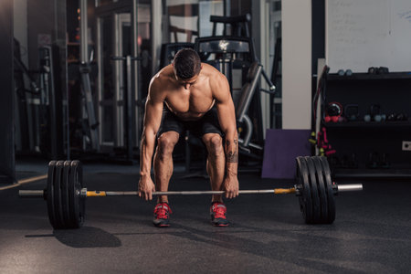 Young muscular man in the gym doing exerciseの写真素材