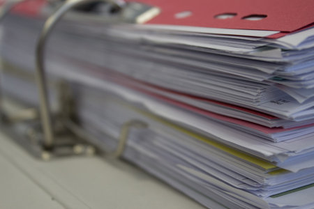 Paperwork in a ring binder folder with dividersの写真素材