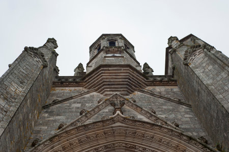 Looking up at the front of a French medieval church.の写真素材
