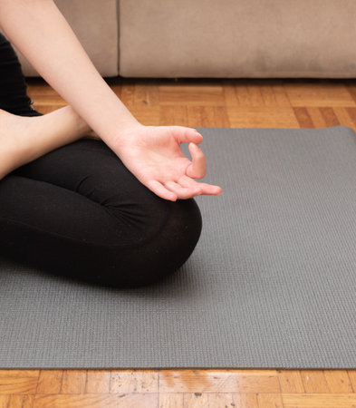 Close up of the yoga lotus pose of an unrecognizable person.の写真素材