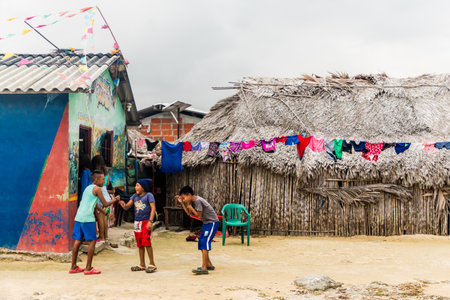 San blas islands, Panama. March 2018. A view of children playing outside a typical house in the san Blas Islands, Panama.のeditorial素材