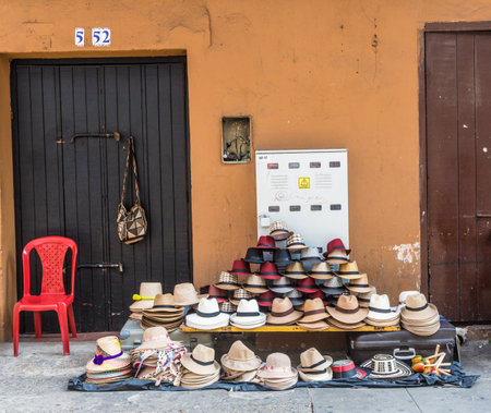 Cartagena, Colombia. April 2018. A view of a typical street stall selling hats in cartagena colombia.のeditorial素材