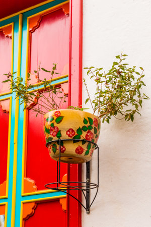 A view a colorful flower pot in the picturesque town of Jardin in Colombia.の写真素材