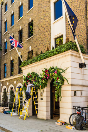 London. May 2018. A view of workman putting up decorations at the halkin hotel londonのeditorial素材