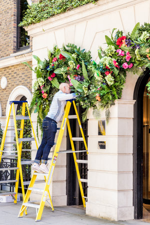 London. May 2018. A view of workman putting up decorations at the halkin hotel londonのeditorial素材