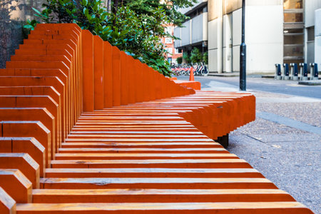 A view of an abstract orange bench in the city of Londonの写真素材
