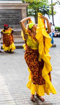 Cartagena, Colombia. March 2018. A view of a colorful dancer in Parque Bolivar in Cartagena colombiaのeditorial素材