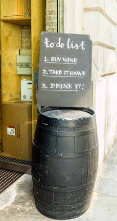 London. May 2018. A view of a to do list outside New street wine in the City of london in London.