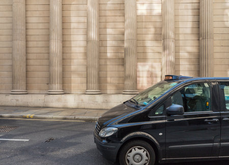 London. May 2018. A view of of a typical London taxi outside the Bank of England in the City of london in London.のeditorial素材