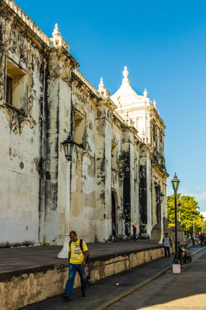Leon, Nicaragua. February 2018. A view of a person walking outside Cathedral Asuncion in Leon Nicaraguaのeditorial素材