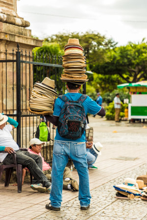 Leon, Nicaragua. February 2018. A view of a mobile hat sellerin Granada Nicaraguaのeditorial素材