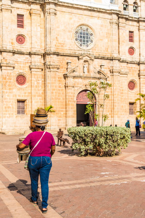 Cartagena, Colombia. march 2018. A view of a hat seller outside cathedral San Pedro Claver in Cartagena Colombia.のeditorial素材