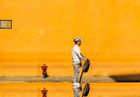 Cartagena, Colombia. April 2018. A view of a tourist on a segway in the old town in Cartagena, Colombia.のeditorial素材