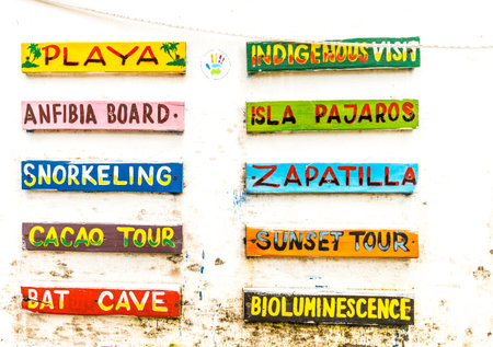 Colon Island, Bocas del Toro, Panama. A sign outside a tour office on Colon Island in Bocas Del Toro, Panama.のeditorial素材