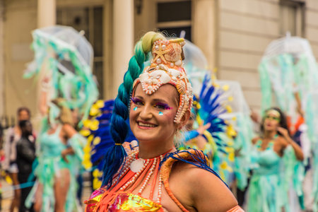 London. August 27 2018. A Colourfully dressed participant during the Grand Parade, Notting Hill...