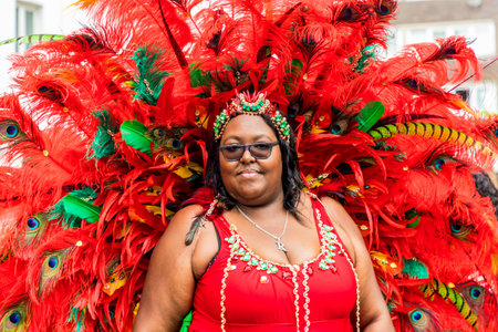 London. August 27 2018. A Colourfully dressed participant during the Grand Parade, Notting Hill Carnival, in London.のeditorial素材