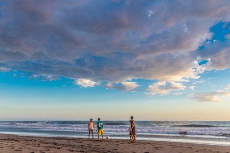 El Zonte, El Salvador. February 2018. A view of boys playing football on the beach in El Zonte in El Salvador.のeditorial素材