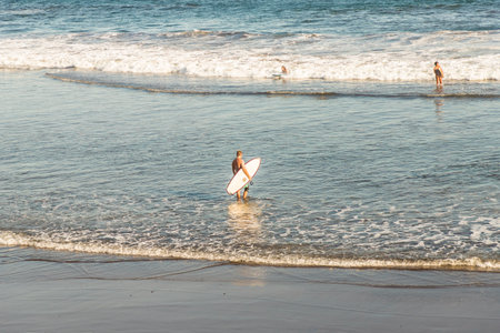 El Zonte, El Salvador. February 2018. A view of a surfer on the beach in El Zonte in El Salvador.のeditorial素材