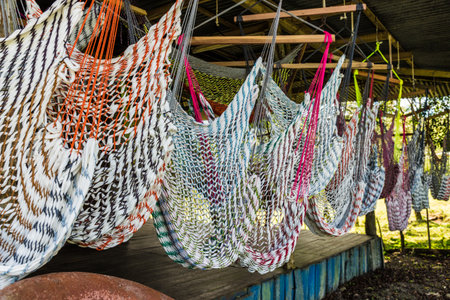 La Fortuna, Costa Rica. March 2018. A view of a souvenir stall seelling hammocks in la Fortuna in Costa Ricaの写真素材