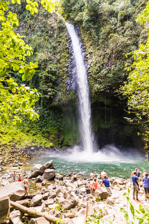 La Fortuna, Costa Rica. March 2018. A view of tourists at the La Fortuna waterfall in Costa Ricaのeditorial素材