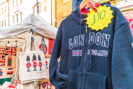 London. November 2018. A view of a market stall selling london theamed goods at Portobello Road...