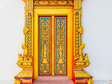 Detail on the doors at Chalong temple in Phuketの写真素材