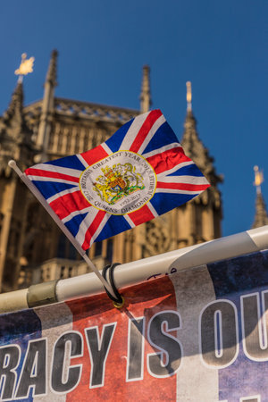 March 29 2019. London. Union flags flying by parliament in parliament square Londonのeditorial素材
