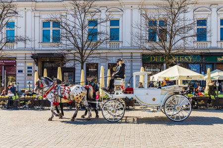Krakow Poland. April 2019. A view of a horse drawn carriage in the medieval old town in Krakow Polandのeditorial素材