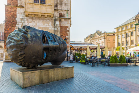 Krakow Poland. April 2019. A view of the sculpture Eros by Igor Mitoraj in the medieval old town square in Krakowのeditorial素材